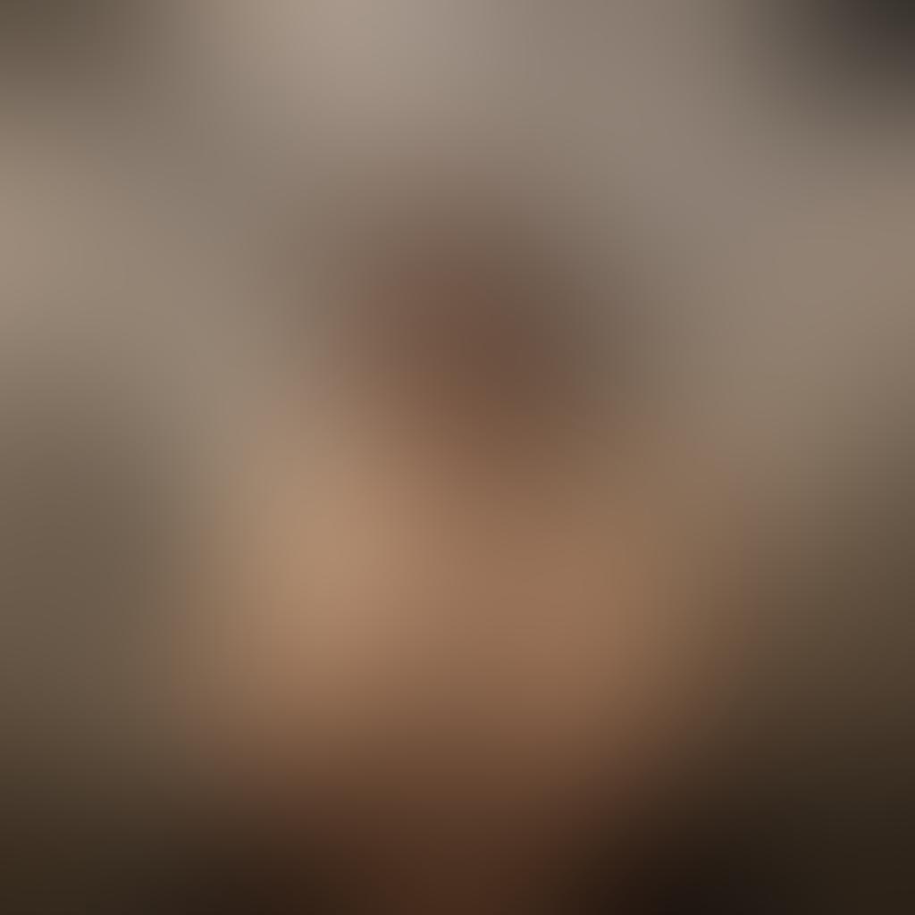 A captivating photograph that juxtaposes sensuality and censorship, featuring a partially draped figure in soft lighting, surrounded by blurred images of iconic censored artworks. The foreground shows delicate hands masking a bright, expressive face, symbolizing the struggle between freedom of expression and societal restrictions. The background is a gallery wall with squares where images have been intentionally blurred or blacked out, creating an intriguing contrast. super-realistic. muted tones. dramatic lighting.